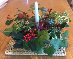 Diana's centrepiece with fresh foliage and candle