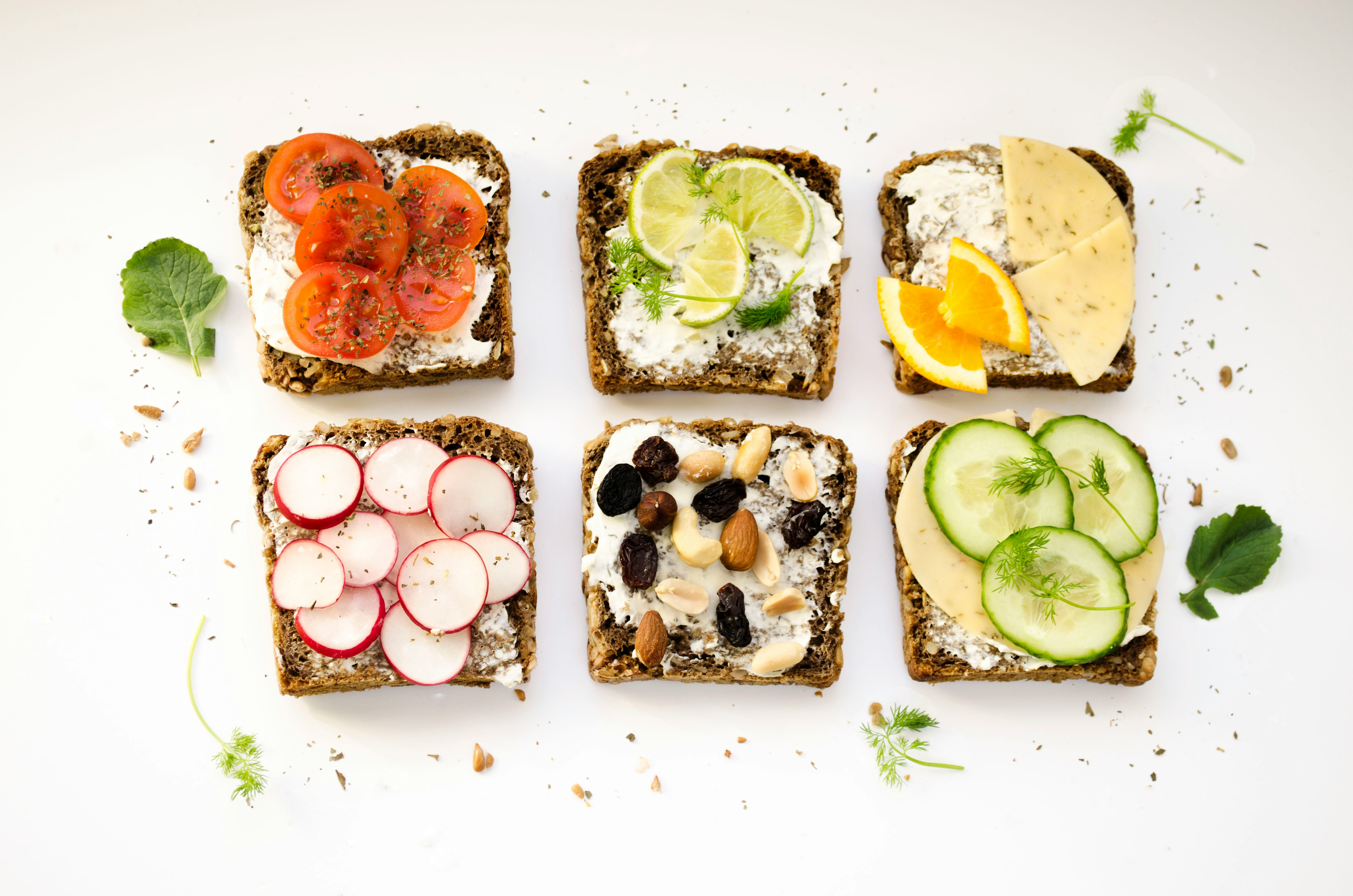 6 slices of brown bread with healthy food spread on them