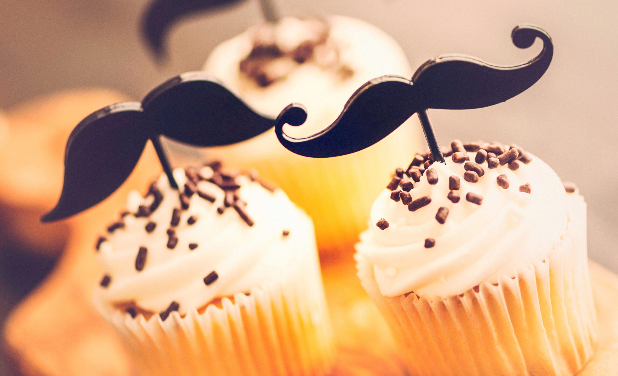 cupcakes with moustache toppers