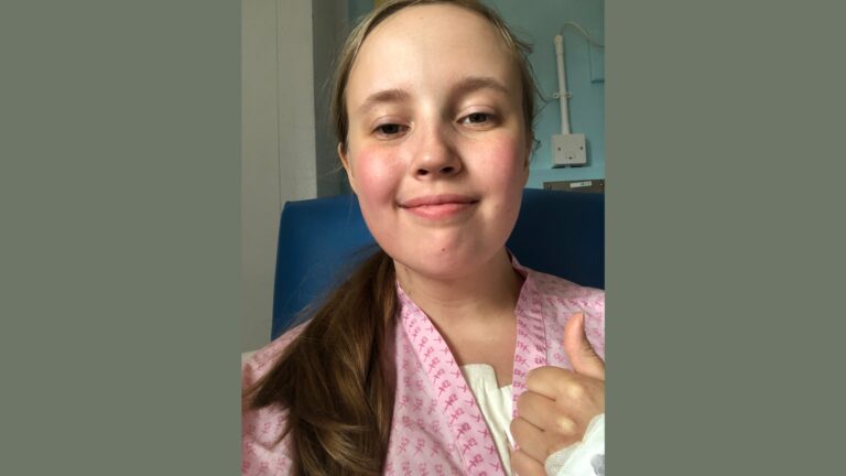 Photo of Chloé, MFT Administrator, at the hospital after having emergency surgery
