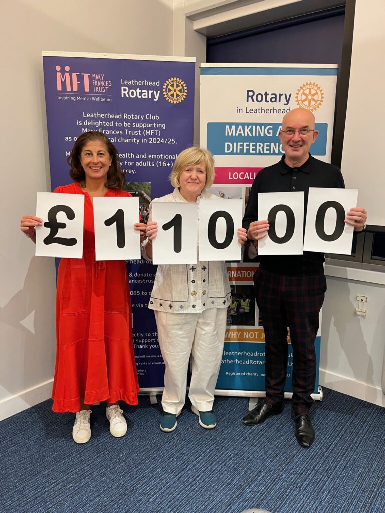 Biba and Matthew from MFT displaying the grand total raised from past President of Leatherhead Rotary, Michelle Rosen